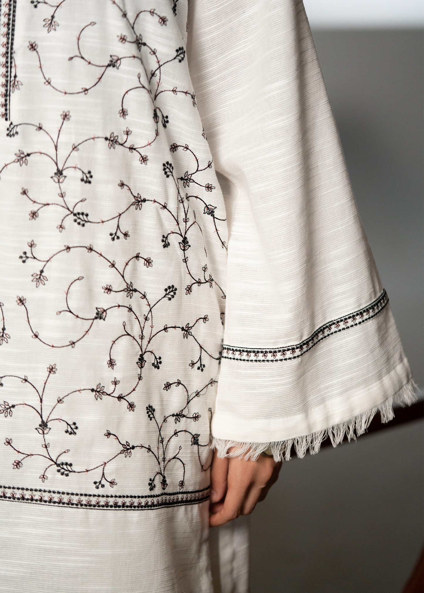 Embroidered White And Black Khaddar Suit