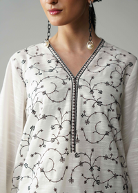 Embroidered White And Black Khaddar Suit