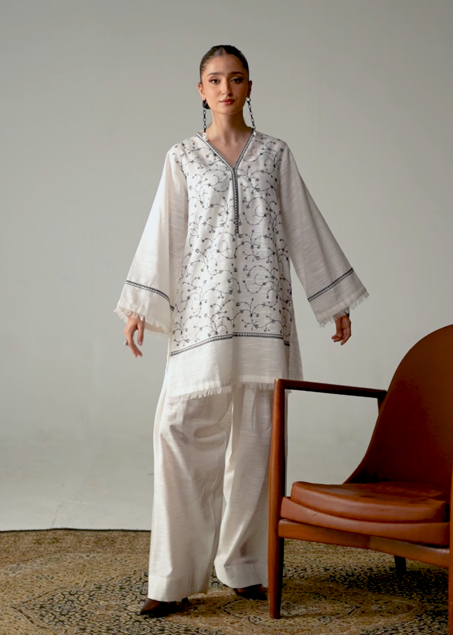 Embroidered White And Black Khaddar Suit